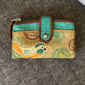Fossil Wallet with bird detail and design.